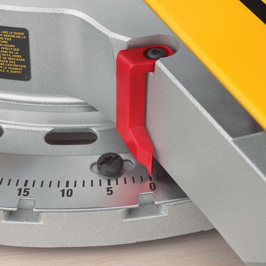 Close-up of DEWALT DWS780, DWS780KIT miter saw angle gauge, with red indicator and black screws.
