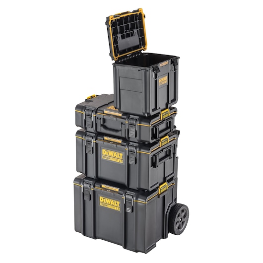 A stack of four black DEWALT ToughSystem 2.0 toolboxes. The top box has its lid open, revealing an empty interior. The boxes are securely stacked, and the bottom box has two wheels for mobility.