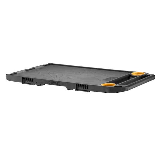 Black DEWALT photography tray with two yellow holders, flat and rectangular, for tool or accessory organization.