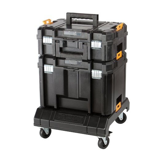 Black DEWALT stackable tool storage boxes with wheels and orange latches on a white background.