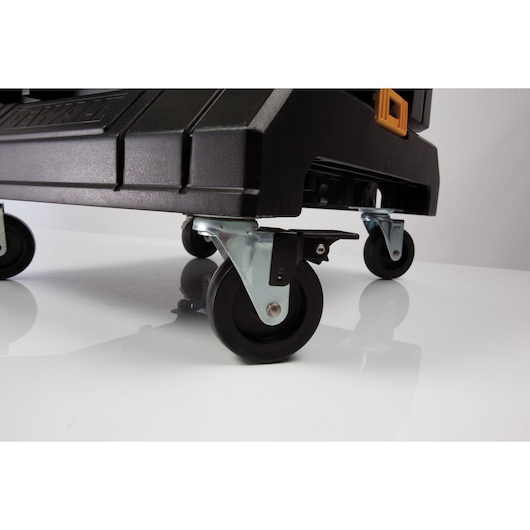 Close-up of DEWALT mobile toolbox wheels, showing the sturdy black plastic and metal casters for easy transport.