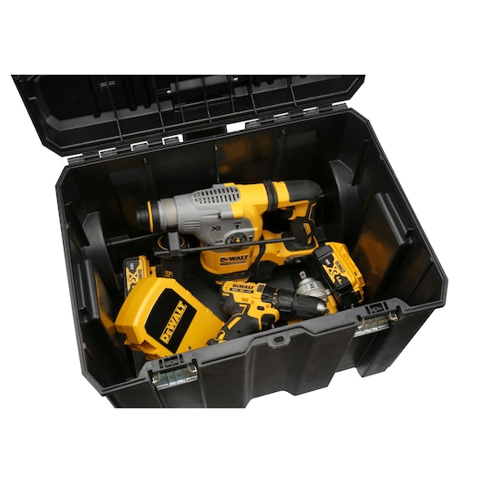 Open DEWALT toolbox containing yellow and black power tools and accessories.