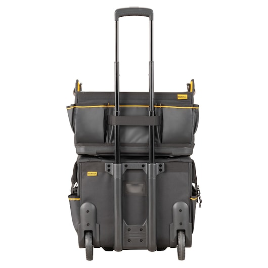 DEWALT rolling tool bag with telescopic handle and multiple compartments, shown upright and ready for transport.