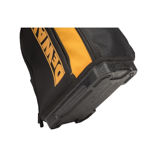 Close-up of DEWALT tool bag’s waterproof base, showing black and yellow design and durable material.