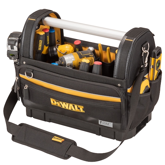 DEWALT tool bag with shoulder strap, filled with various tools. Black and yellow design with a sturdy handle.