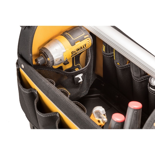Dewalt tool bag with drill and other tools in organized compartments, black and yellow fabric material.