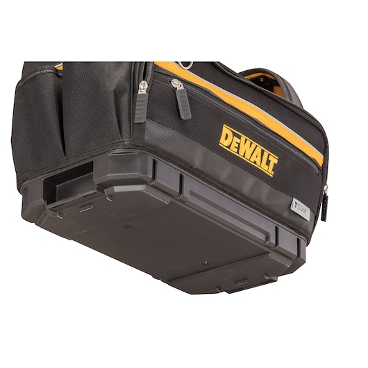Close-up of a DEWALT T-STAK tool bag showing the sturdy plastic base and zippered pockets.