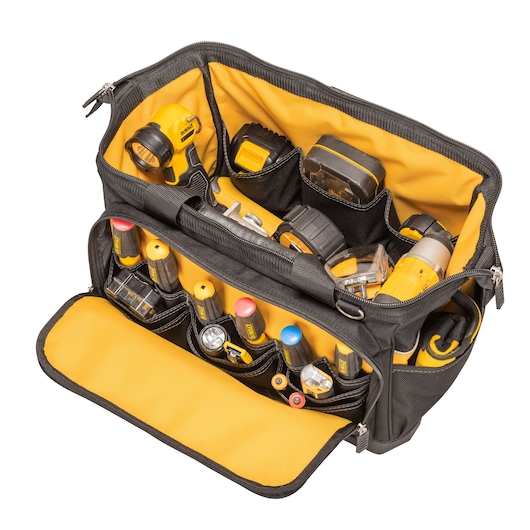 DEWALT tool bag with yellow interior, various hand tools and accessories organized in compartments.