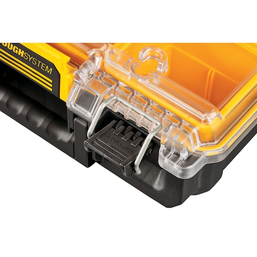 Close-up of DEWALT DWST83392-1 toolbox with transparent lid, sturdy latch, and yellow compartments.
