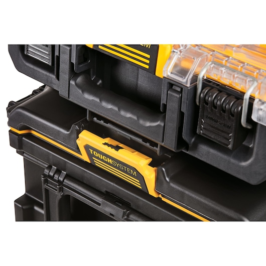 Close-up of stacked DEWALT ToughSystem toolboxes with visible handle and latch detail.