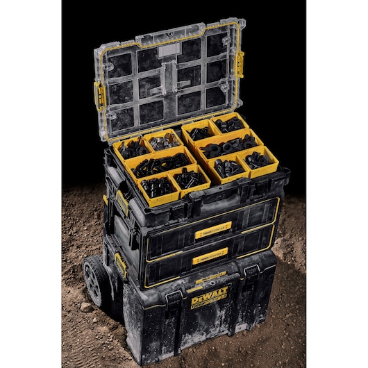 DEWALT ToughSystem stack with open organizer, showing yellow compartments filled with various hardware.