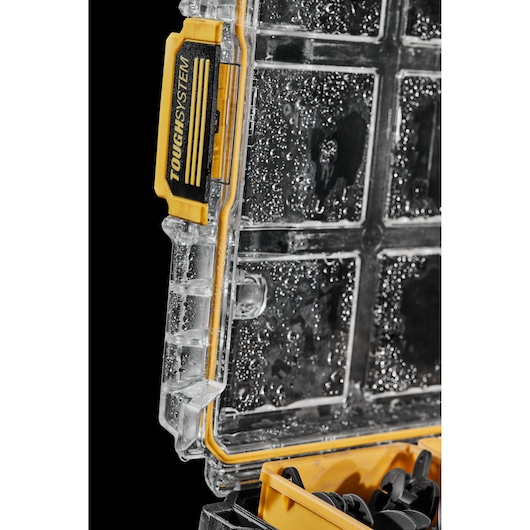 DEWALT ToughSystem waterproof tool case lid with yellow latch and interior compartments visible.