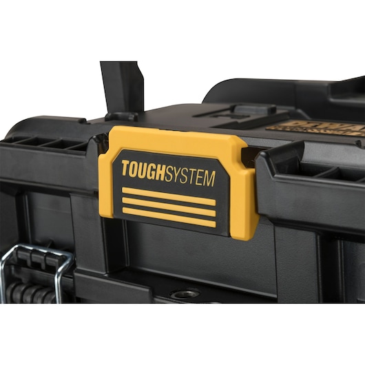 Close-up of a DEWALT ToughSystem black toolbox with yellow latch.