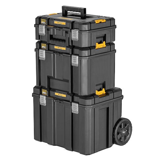 A stack of DEWALT TSTAK black modular tool storage boxes with yellow latches, silver clips, and a handle on top. The bottom box features wheels for easy mobility.