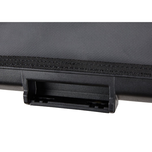 Close-up of a black DEWALT case latch with textured surface and fabric edge detail.