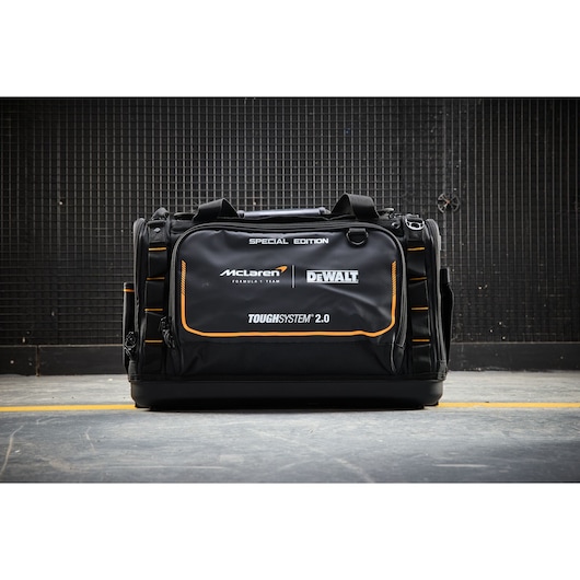 DEWALT ToughSystem 2.0 Black Special Edition tool bag with McLaren branding on a concrete floor.