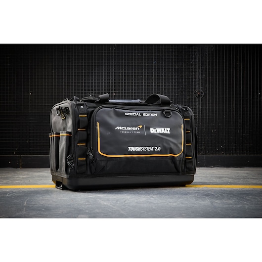Black Dewalt ToughSystem 2.0 tool bag, special edition with McLaren branding, on a concrete floor.