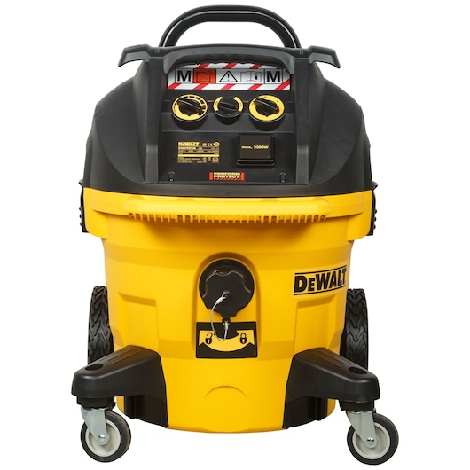 Front view of a yellow DEWALT DWV902M vacuum cleaner with wheels and control dials.