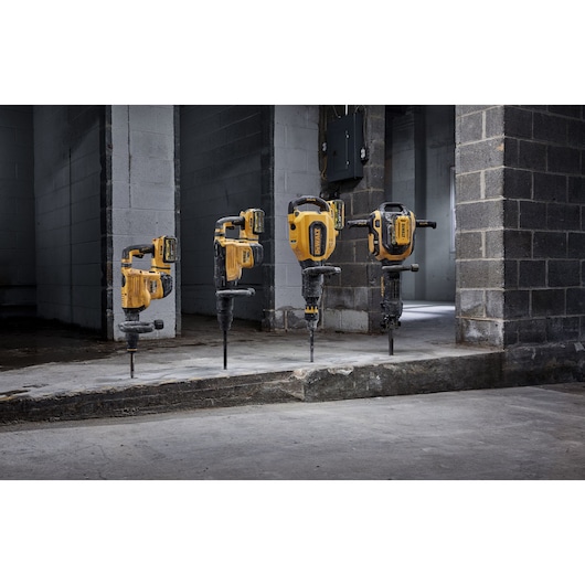 DEWALT drills DCH966, DCH892, DCH911, DCH832 lined up at a construction site. Photography product category.