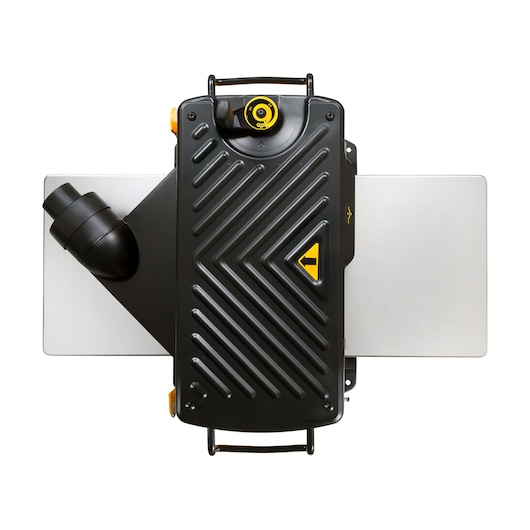 Top view of a DEWALT DW733 planer with black cover, yellow accents, and silver side extensions.