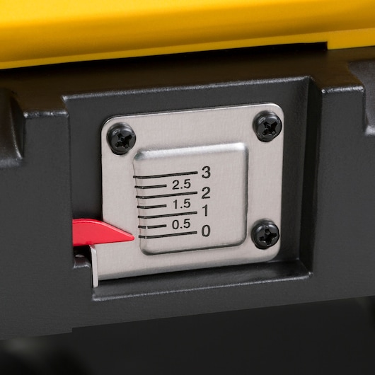 Close-up of a DEWALT DW733 thickness gauge with numeric scale and red indicator for woodworking adjustment.
